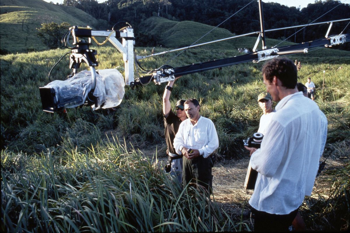 Toll (center, in white shirt) and his crew maneuver the Akela crane arm and Libra 3 remote head into position. The cinematographer used the crane to create smooth, compelling "dolly" shots over the
Australian location's uneven terrain.