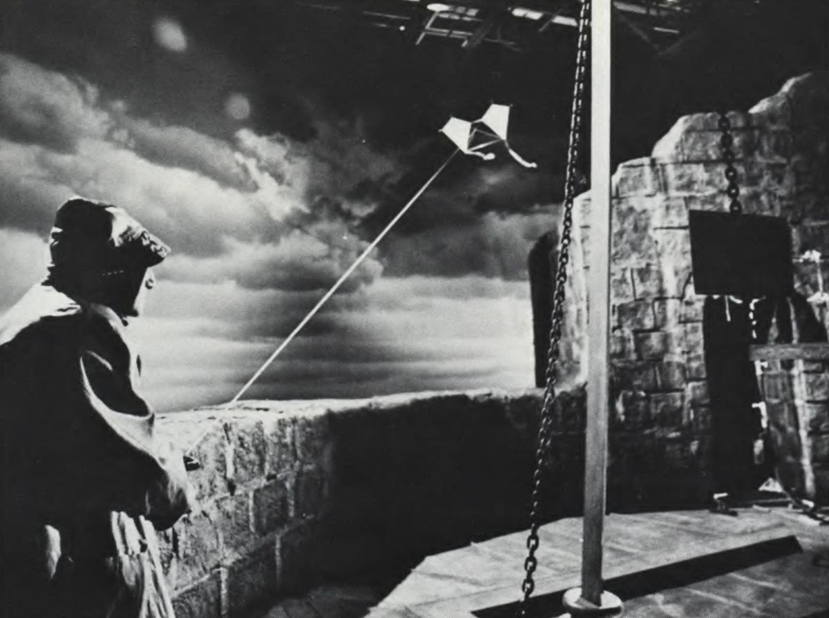 This sequence was created on stage. The kites, used to harness lightning for Dr. Frankenstein’s experiment, were blown by huge fans and guided to the studio grids by invisible piano wire. In the foreground is Igor (Marty Feldman), the good doctor's assistant.