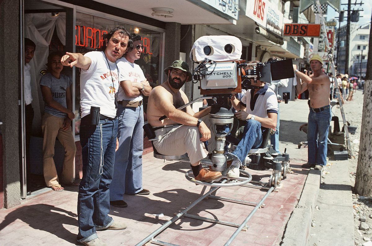 On location in the Philippines, Storaro makes a point to his crew, with Coppola at the eyepiece.