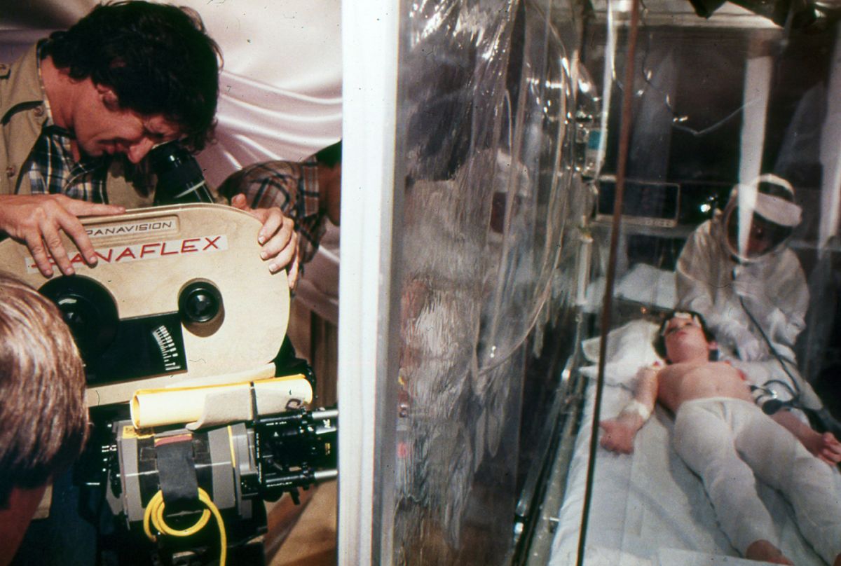 Spielberg checks the frame while setting a shot on Thomas in the medical tent.