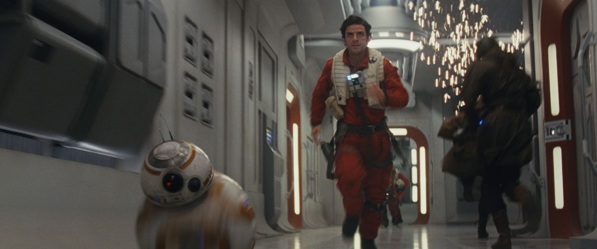 Resistance pilot Poe Dameron (Oscar Isaac) and his faithful droid BB-8 make haste aboard the Resistance command ship.