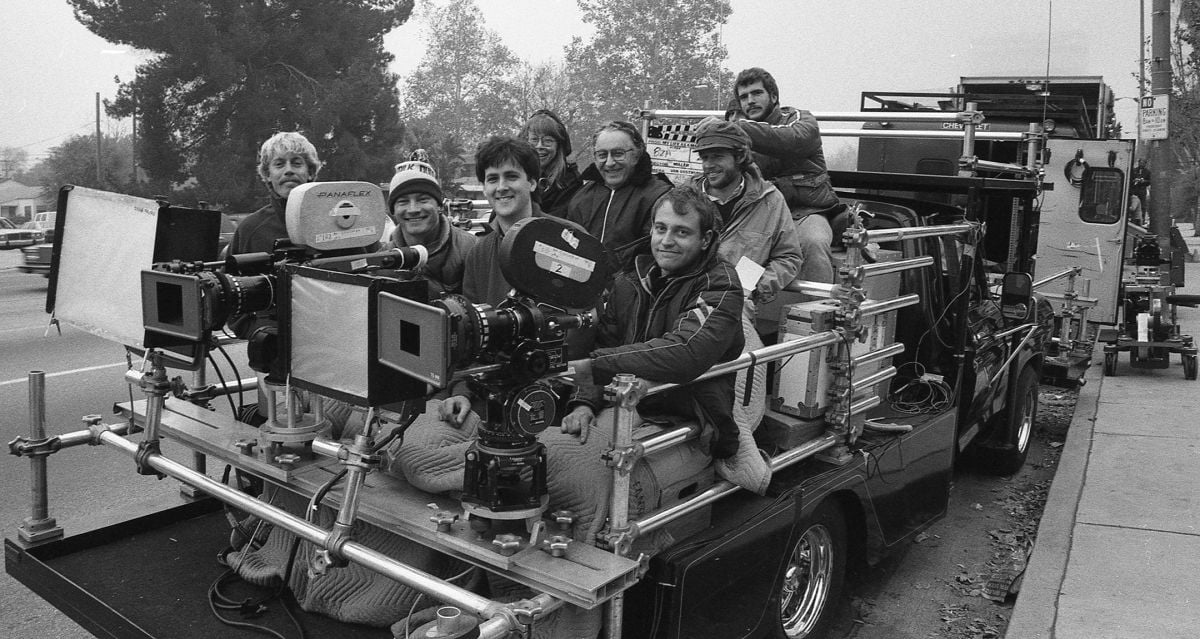 In this shot from the making of the telefilm Her Life as a Man (1984) Caso is operating on the far right. To his left are 1st AC David Waterston (now a DoP), cinematographer Kees van Oostrum (now President of the ASC) and best boy/gaffer Patrick Reddish. Behind them are (from left) script supervisor Dawn Freer director Robert Ellis Miller 2nd AC John Connell and an unidentified 2nd AD. (Thanks to David Waterston for this image and caption information.)