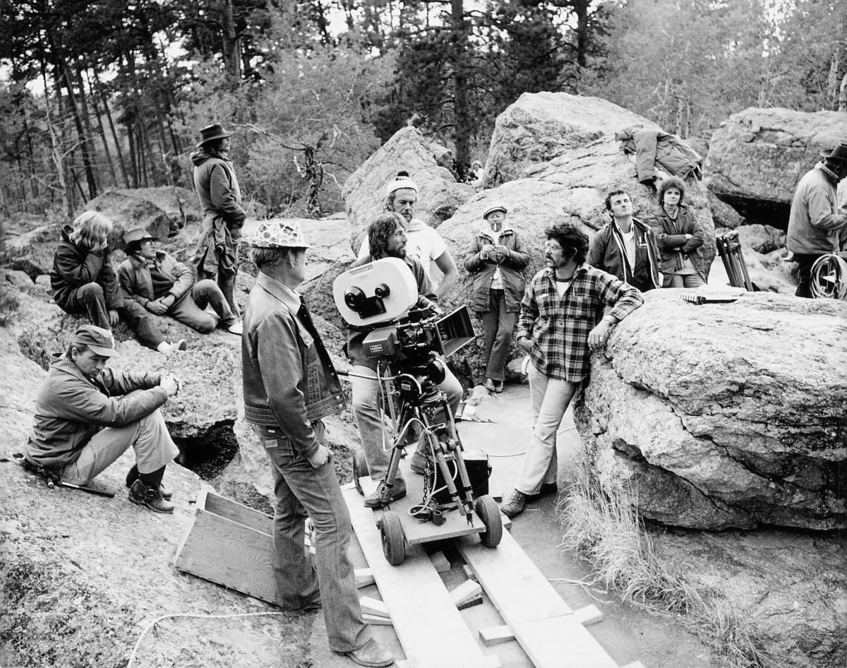 Director Steven Spielberg (reclining in hat at upper left), cinematographer and Society member Vilmos Zsigmond (at camera), and the crew of Close Encounters of the Third Kind on location. Zsigmond earned an Academy Award for his work on the picture.