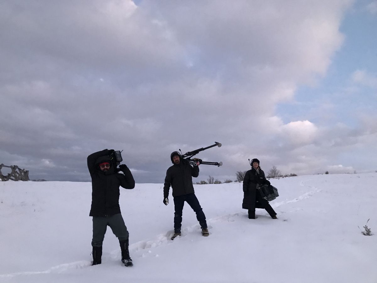 For Wireless, A-camera 1st AC Jared Wennberg, A-camera operator Michael Black and
A-camera 2nd AC Loie Russell-Templeton trek through the snow to set up a wide shot on
location in Snow Basin, Utah.