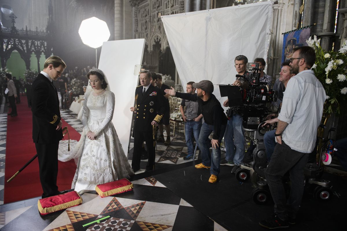 Goldman directs the positioning of a bounce card for the show’s first episode, “Wolferton Splash,” in which Elizabeth II (Foy) weds Prince Philip (Matt Smith).
