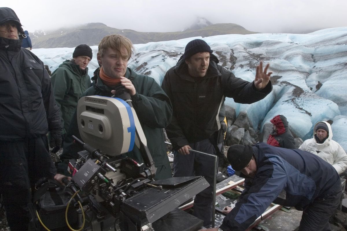 Shooting Batman Begins (2005), director Christopher Nolan (left) and cinematographer Wally Pfister, ASC (right) set up on a glacier.