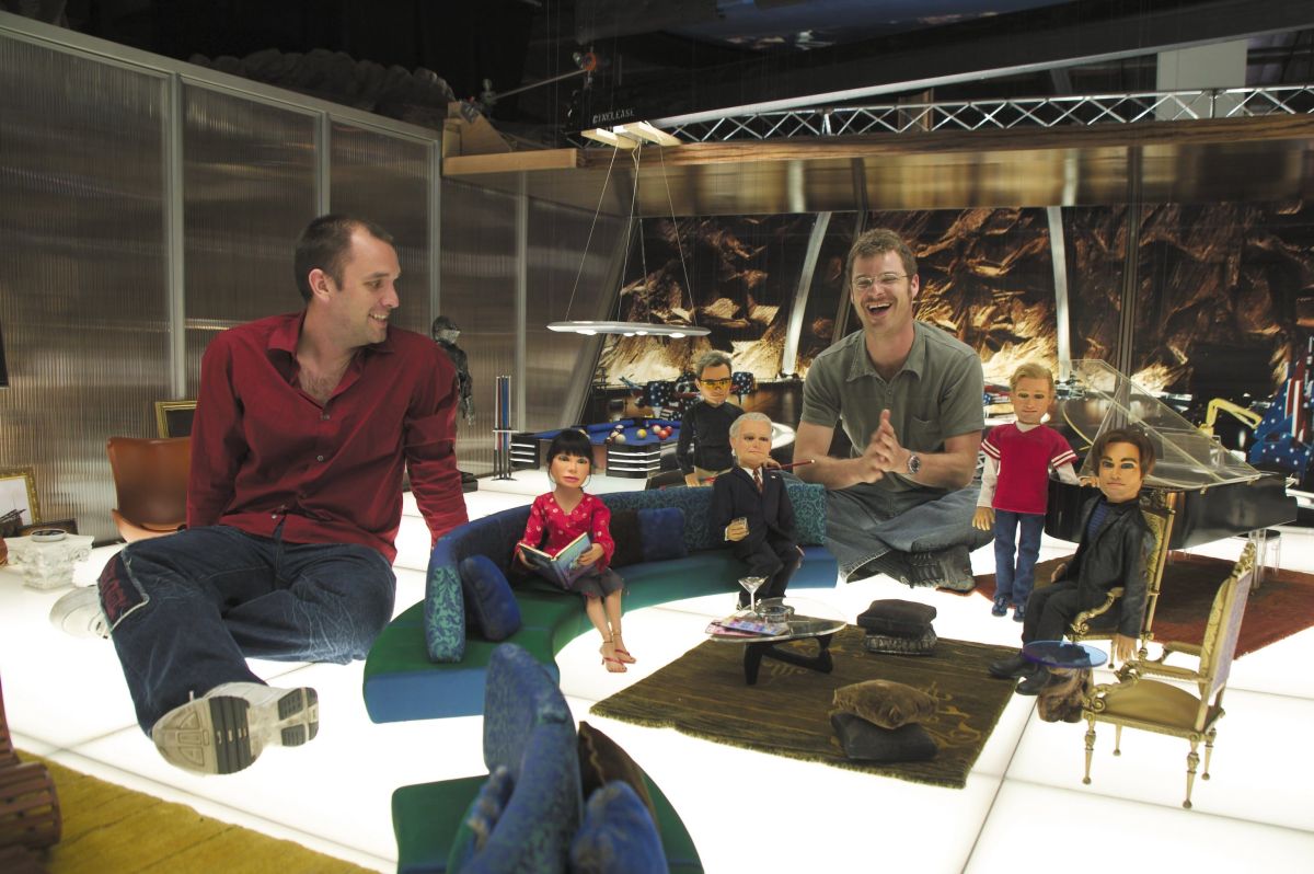 Parker and co-director Matt Stone take five with members of their tiny cast in the Team America headquarters. Pope worked with production designer Jim Dultz to build as much practical lighting as possible into the miniature sets (note the bottom-lit Milk-Plex floor).