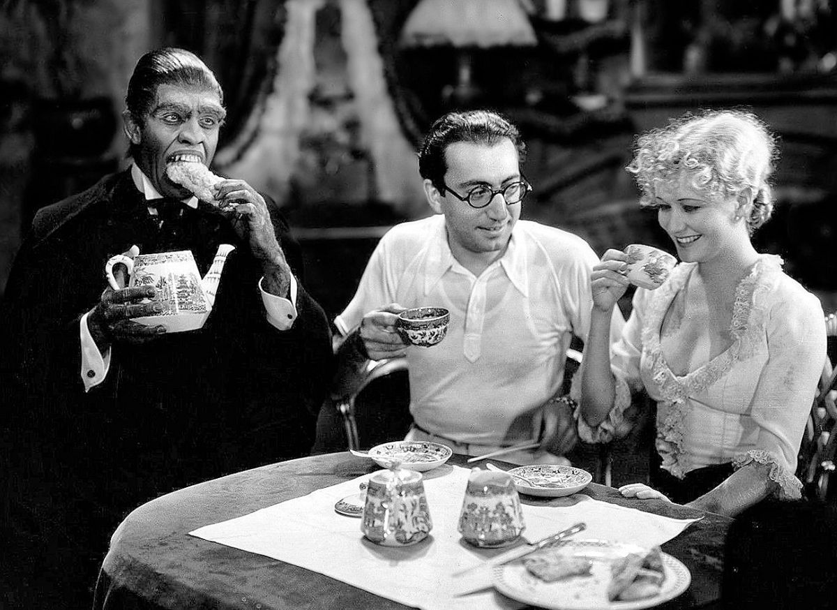 March, director Rouben Mamoulian and actress Miriam Hopkins take tea in a promotional shot from the set.